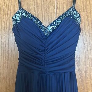 Beautiful sleeveless B Darlin pleated dress with jewel detail in navy blue